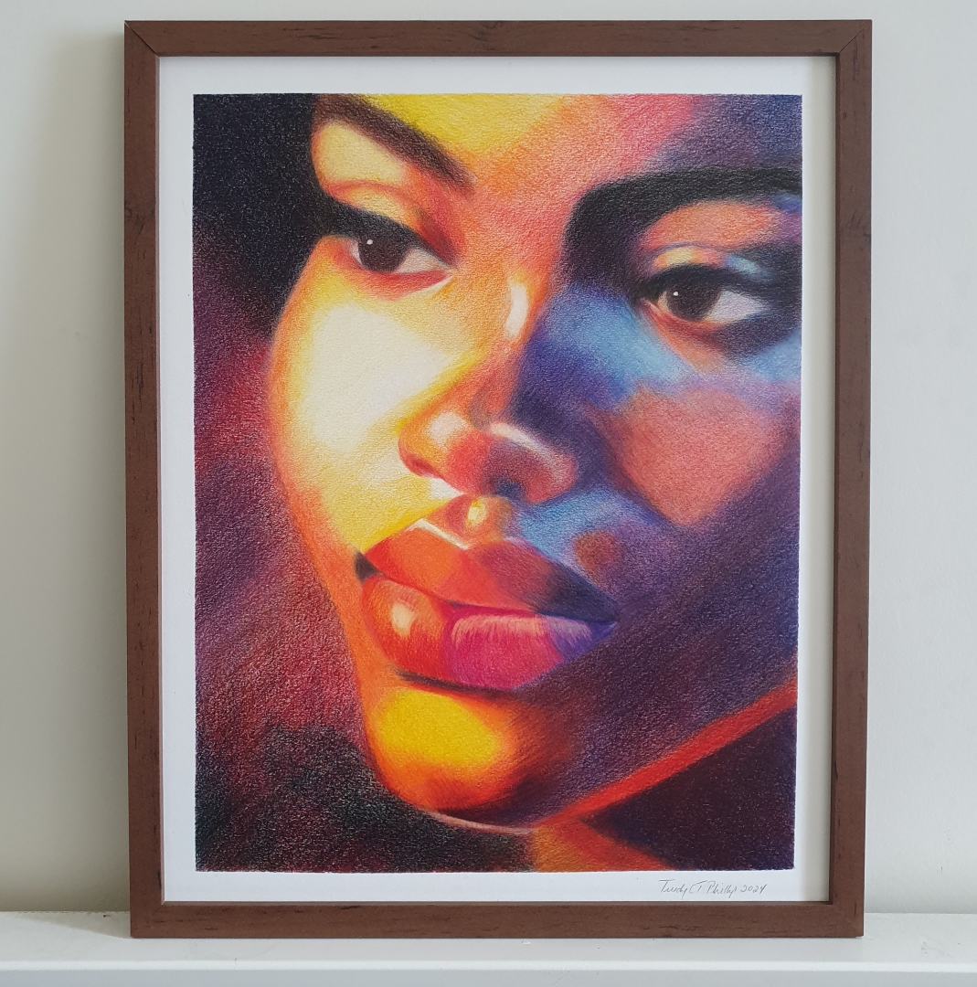 This striking coloured pencil portrait, titled Sunset Kiss, captures the introspective gaze of a woman looking off to her right, bathed in radiant, warm light. The artist skilfully blends rich hues of red, orange, yellow, and purple to create a dynamic interplay between shadow and light, reminiscent of the golden hour just before sunset. The subject's soft, full lips are accentuated by the luminous glow that caresses her face, giving the impression of warmth and serenity. Her eyes, focused on something unseen, evoke a sense of quiet reflection, while the precise detailing in her lashes and brows enhances her expressive gaze. The contrast between the cool blues and purples on one side of her face and the fiery tones on the other suggests a moment of transition, as day fades into night. The subtle texture created by the pencil strokes adds depth, drawing the viewer into this delicate, emotive moment. The title Sunset Kiss aptly conveys the fleeting beauty of this illuminated scene.